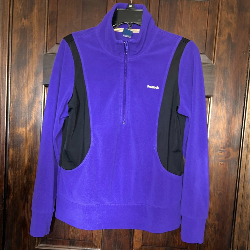 Reebok Ladies 1/4 zip Purple&Black Fleece. Detail stitching left back shoulder.